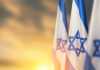 Deadliest Day for Jews Since the Holocaust Spurs a Crisis of Confidence in the Idea of Israel – And Its Possible Renewal Israel flags with a star of David over cloudy sky background on sunset. Banner with place for text.