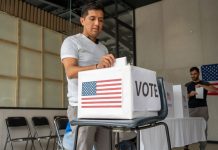 What Happens Before a Voter Reaches the Ballot? Voter Decision-Making - man placing his vote ballot